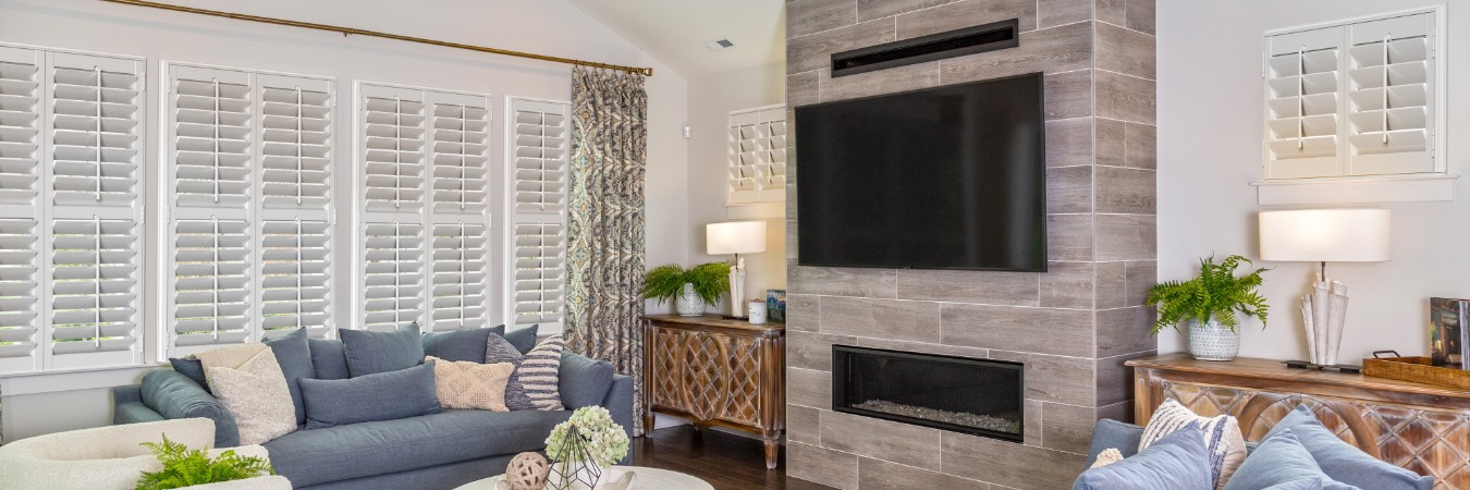 Interior shutters in Independence living room with fireplace