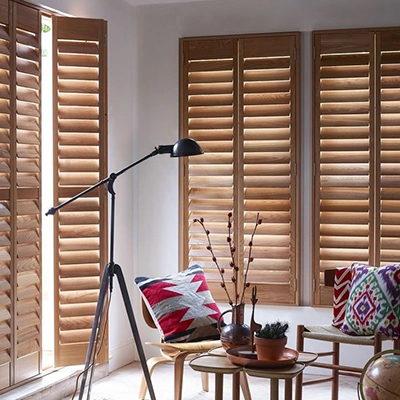 Light brown ovation shutters in a corner of a living room