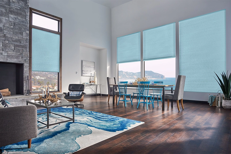 Smart motorized window shades are perfect on tall windows in your Cleveland home. Blue motorized shades on tall living room windows
