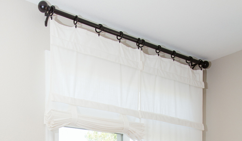 Tumble shades in Cleveland give your doors privacy versatility and style. White tumble shade on double glass doors